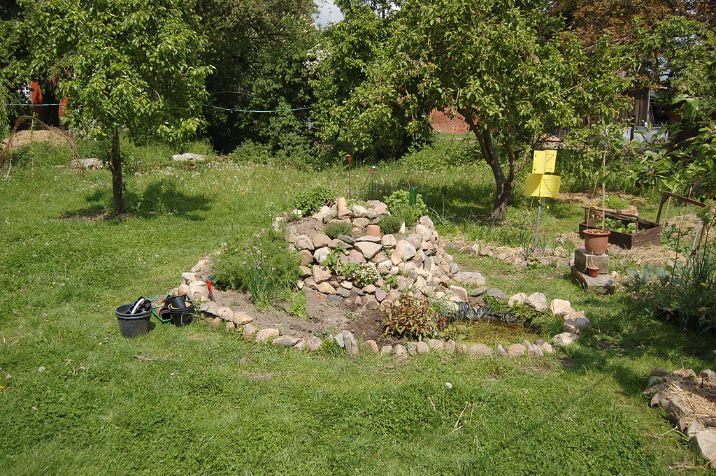 Ready-built stone herb spiral with pond